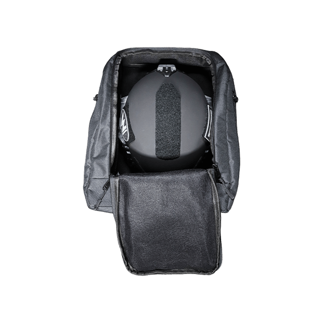 Black backpack with a helmet inside on a white background