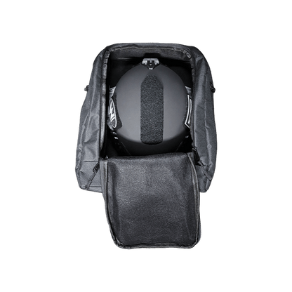 Black backpack with a helmet inside on a white background