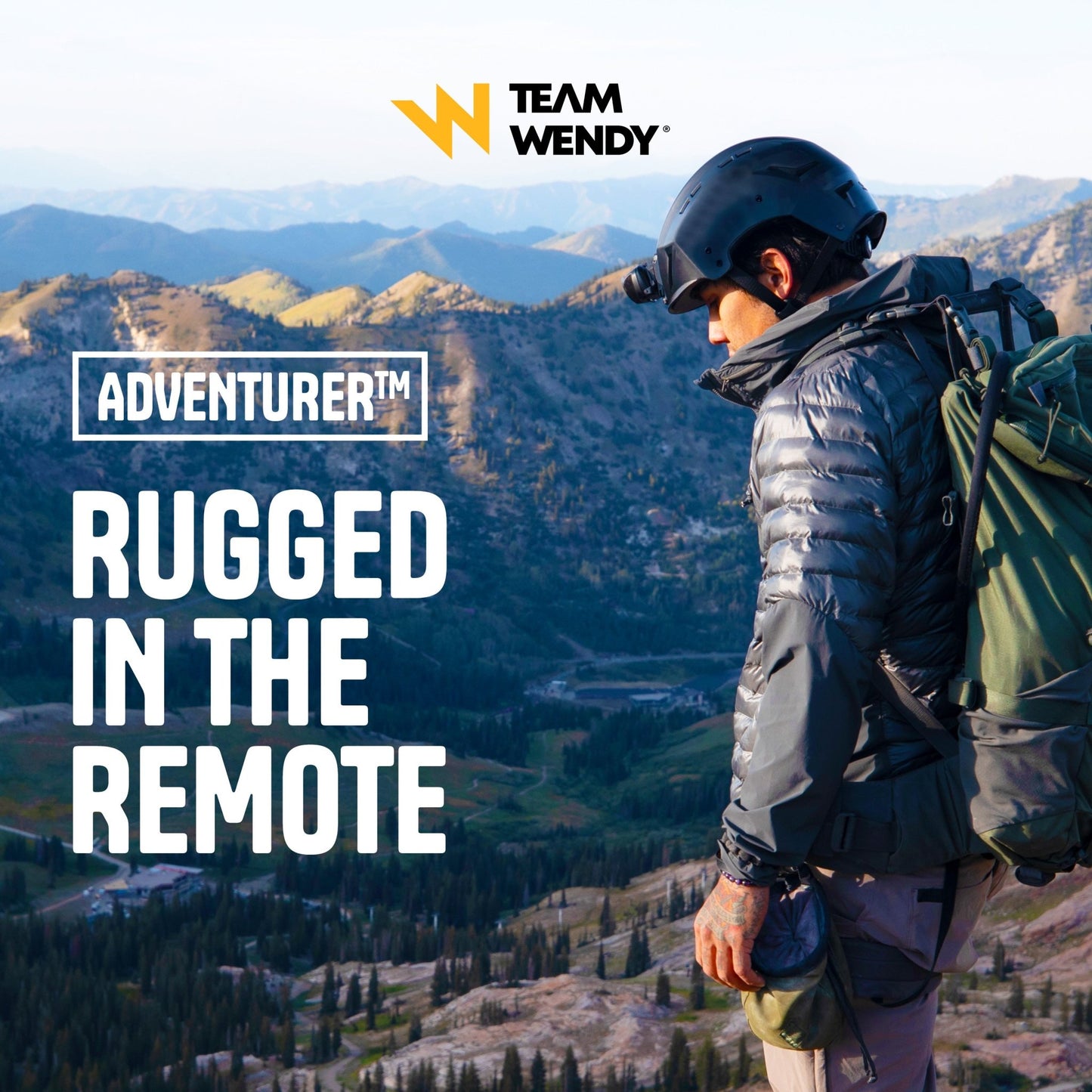 Person with a backpack and helmet overlooking mountains, with 'Team Wendy' branding.