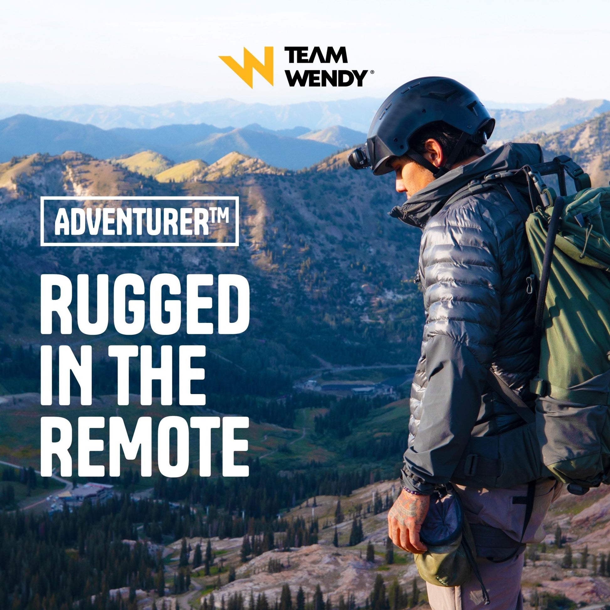Person with a backpack and helmet overlooking mountains, with 'Team Wendy' branding.
