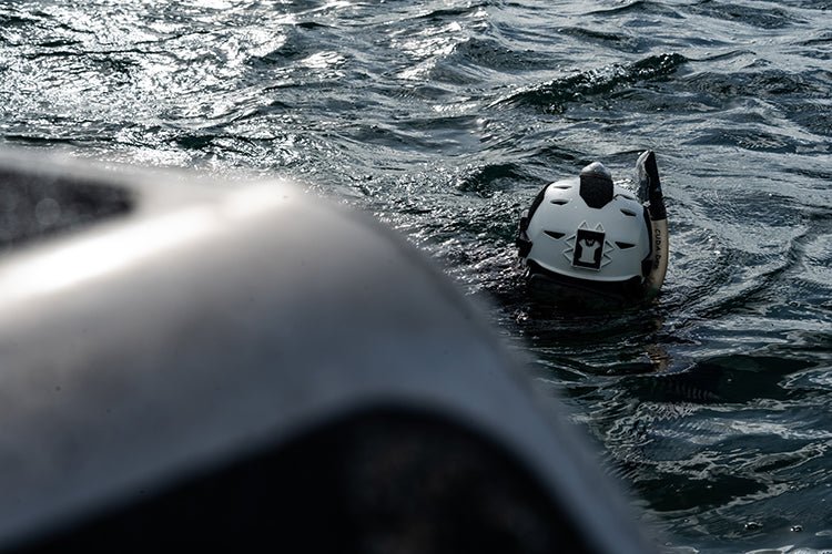 white team wendy helmet in the water