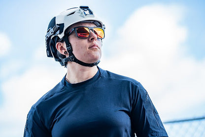 Woman wearing White Team Wendy helmet and sunglasses