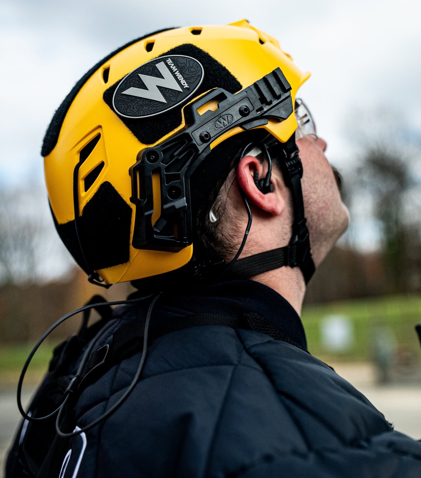 Man wearing yellow team wendy helmet